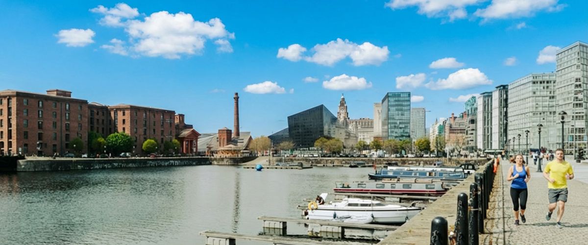 Two university students following a running route along the Liverpool waterfront