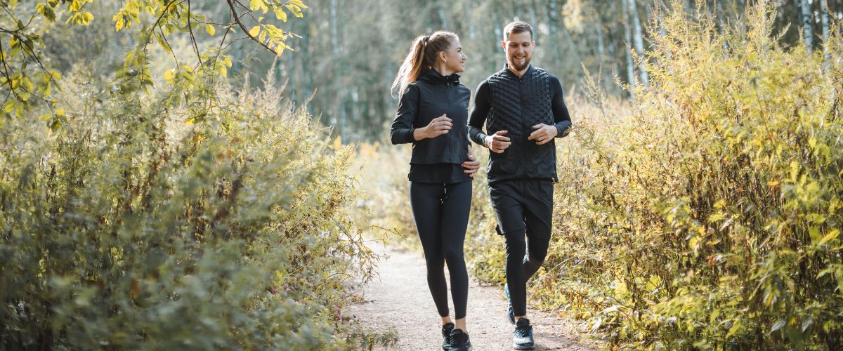 Two students following a running route through Sefton Park
